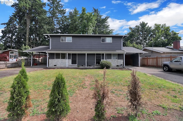 522 River Loop Unit 2, Eugene, OR 97404 - view of front of property with driveway, an attached carport, a sunroom, and crawl space