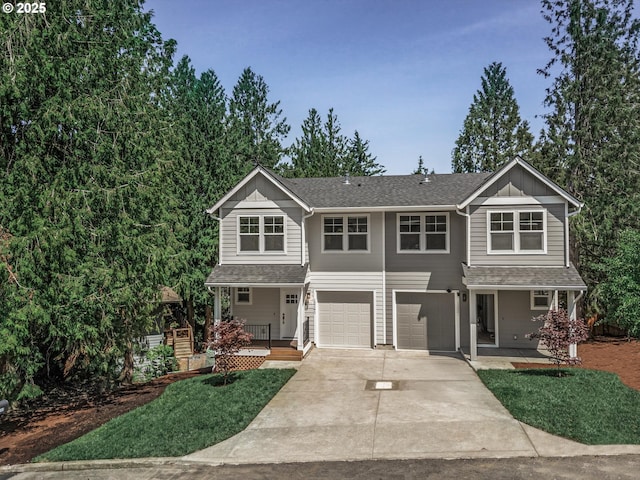 12141 SE Knapp Ln, Portland, OR 97266 - view of front of house featuring a porch, concrete driveway, a garage, and board and batten siding