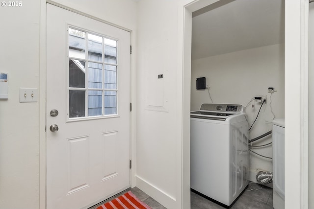 clothes washing area featuring washer / dryer and laundry area