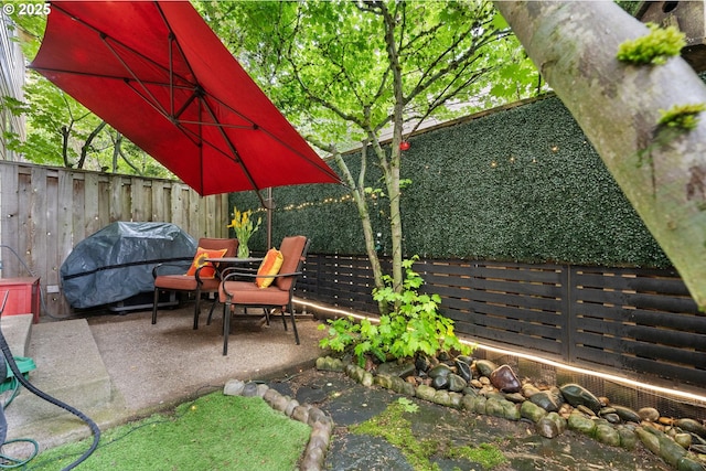 2036 NW Village Cir, Portland, OR 97229 - view of patio featuring area for grilling and a fenced backyard