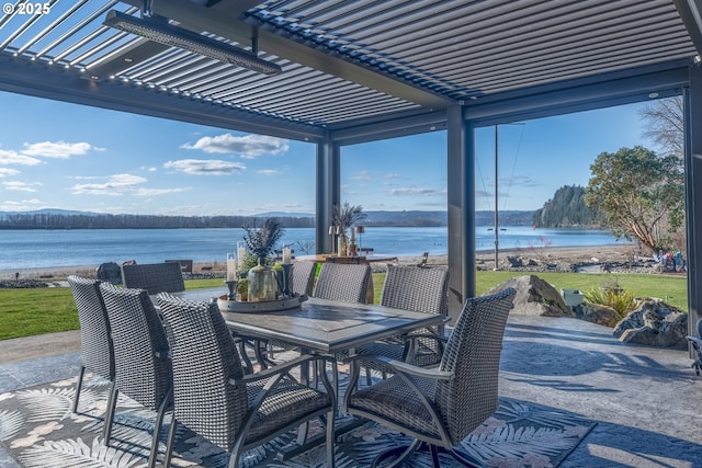 view of patio / terrace featuring a water view and a pergola