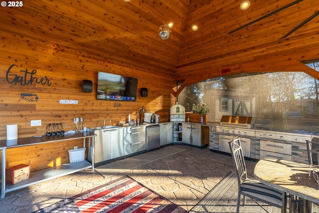 view of patio featuring an outdoor kitchen and a grill