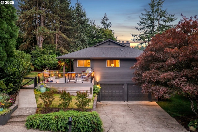 16909 Crestview Dr, Lake Oswego, OR 97034 - view of front of house with a garage, concrete driveway, a shingled roof, and a wooden deck