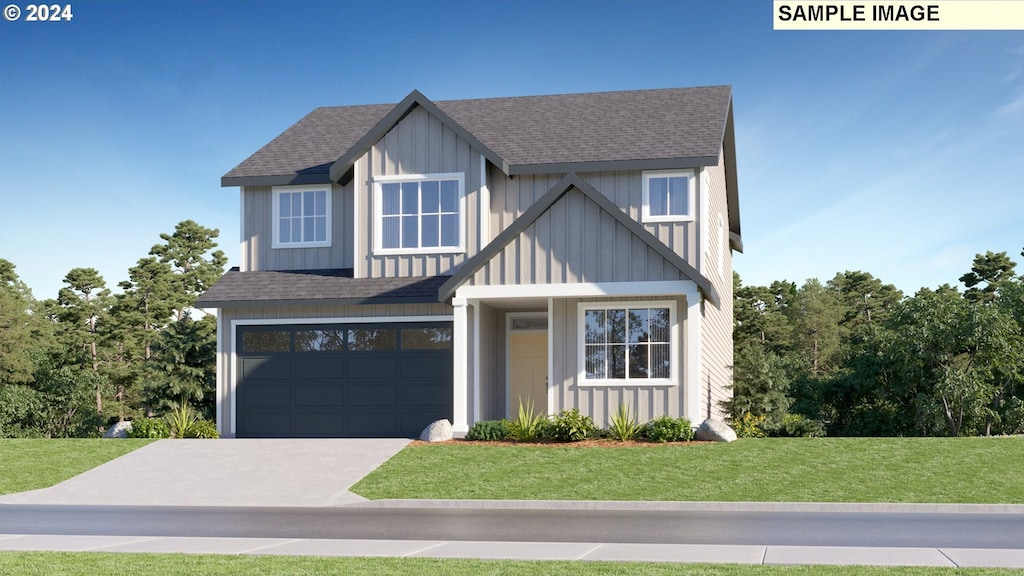 view of front of house featuring a front yard and a garage