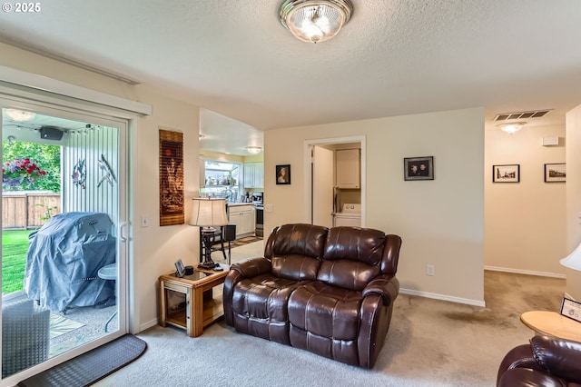 4730 SW 189th Pl, Beaverton, OR 97078 - living room with visible vents, carpet, washer / clothes dryer, and a wealth of natural light