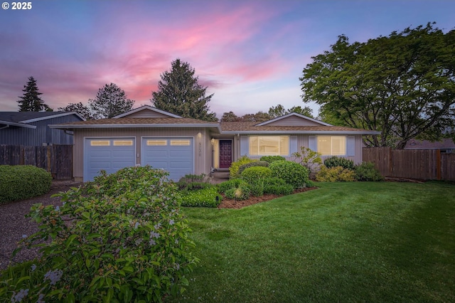 4730 SW 189th Pl, Beaverton, OR 97078 - ranch-style house with fence, a lawn, and a garage