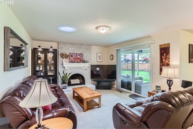 4730 SW 189th Pl, Beaverton, OR 97078 - carpeted living room featuring a textured ceiling and a fireplace
