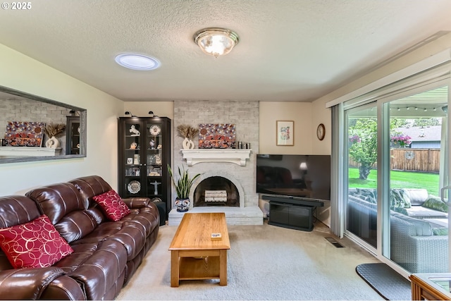 4730 SW 189th Pl, Beaverton, OR 97078 - carpeted living room with a brick fireplace, a textured ceiling, and visible vents