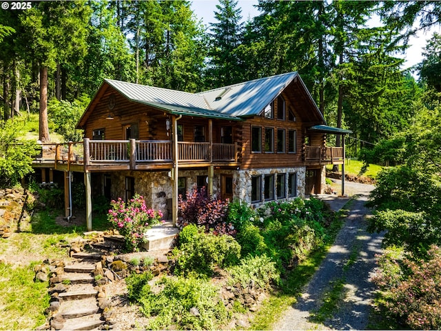 86561 R R Baker Rd, Springfield, OR 97478 - cabin featuring log exterior, driveway, stone siding, and a deck