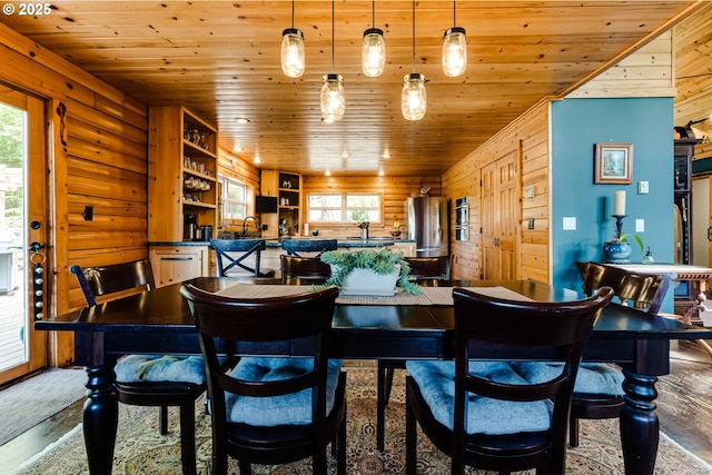 86561 R R Baker Rd, Springfield, OR 97478 - dining area featuring healthy amount of natural light, wood ceiling, wooden walls, wood finished floors, and rustic walls