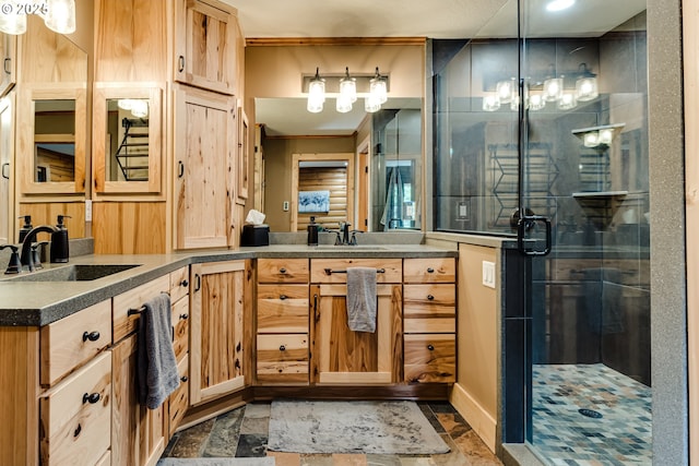 86561 R R Baker Rd, Springfield, OR 97478 - bathroom featuring double vanity, a shower stall, and stone finish floors