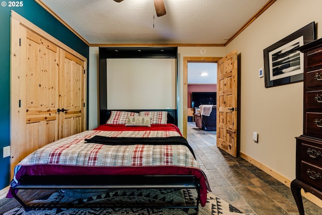 86561 R R Baker Rd, Springfield, OR 97478 - bedroom featuring baseboards, ornamental molding, dark stone finish flooring, and ceiling fan