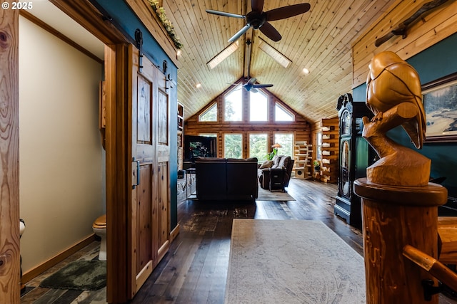 86561 R R Baker Rd, Springfield, OR 97478 - foyer featuring ceiling fan, hardwood / wood-style floors, a barn door, baseboards, and vaulted ceiling