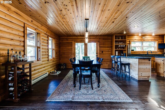 86561 R R Baker Rd, Springfield, OR 97478 - dining room with a baseboard heating unit, rustic walls, dark wood finished floors, and wooden ceiling