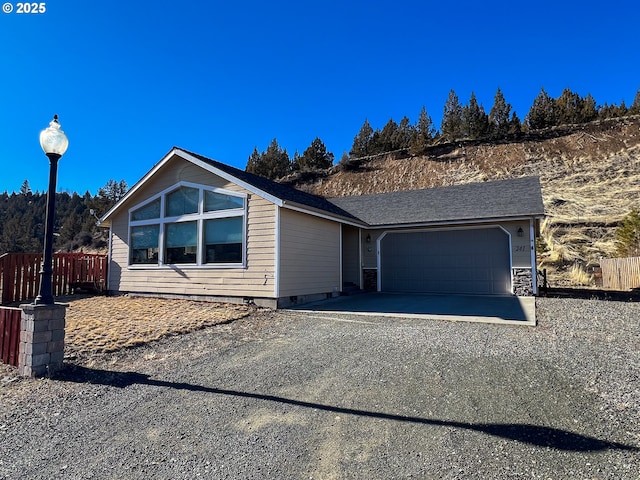 ranch-style house featuring a garage