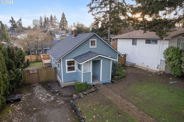 back of house featuring a yard