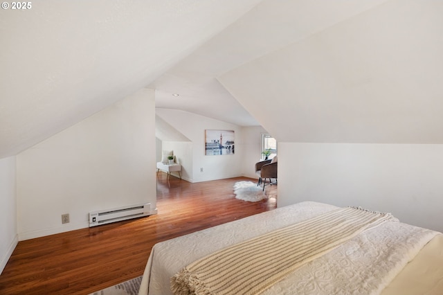 bedroom with vaulted ceiling, baseboard heating, and wood-type flooring