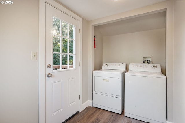 washroom featuring washing machine and dryer and hardwood / wood-style flooring