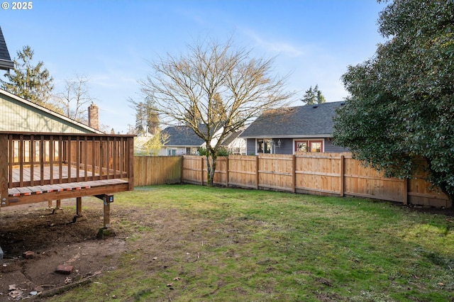 view of yard featuring a wooden deck