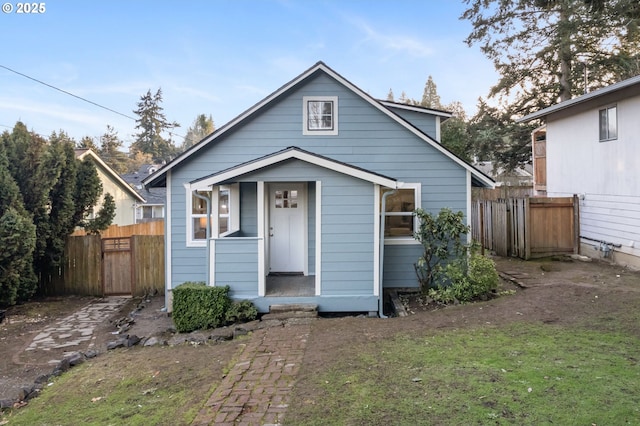 bungalow-style house with a front yard