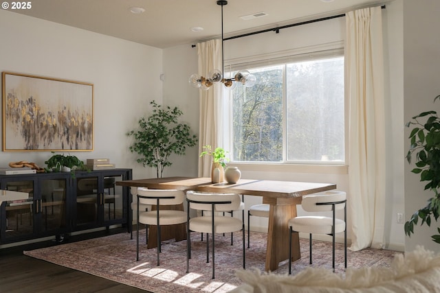 dining area with wood finished floors