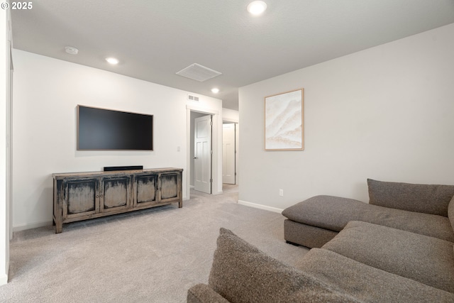 carpeted living room featuring visible vents, recessed lighting, and baseboards