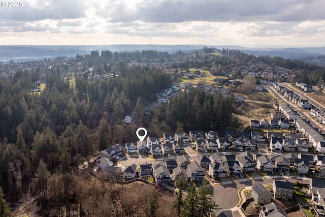 birds eye view of property with a residential view