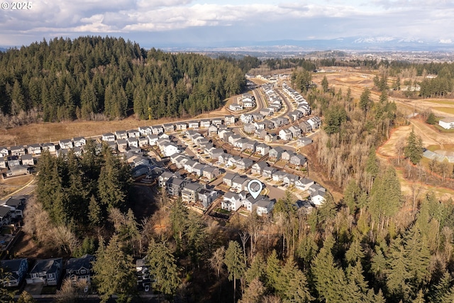 drone / aerial view featuring a view of trees