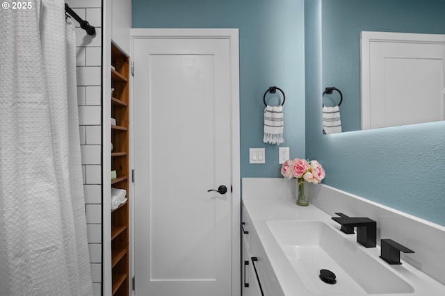 4112 NE 80th Ave, Portland, OR 97218 - bathroom featuring vanity, a textured wall, and a shower with shower curtain
