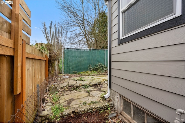 view of side of property featuring a fenced backyard