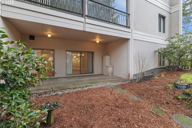 doorway to property featuring a patio