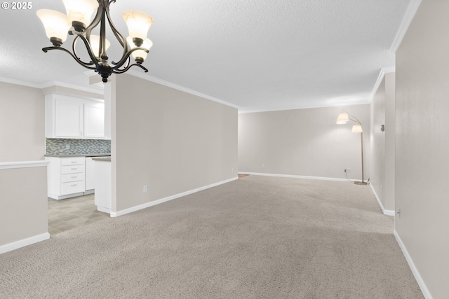 unfurnished living room with ornamental molding, light carpet, and a notable chandelier