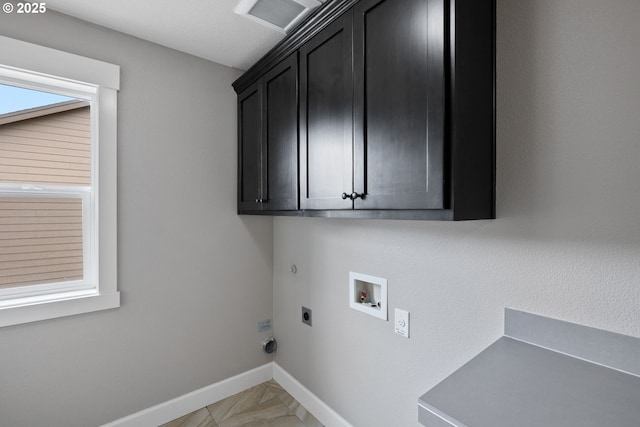 12795 Lindsay Anne Ln, Oregon City, OR 97045 - laundry area featuring cabinet space, hookup for an electric dryer, washer hookup, hookup for a gas dryer, and baseboards