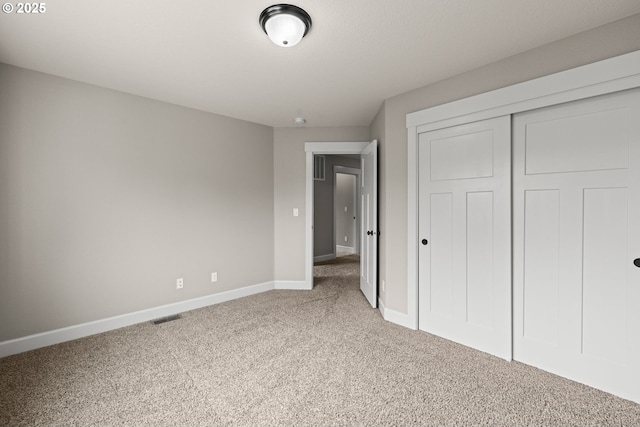 12795 Lindsay Anne Ln, Oregon City, OR 97045 - unfurnished bedroom featuring carpet floors, baseboards, and a closet