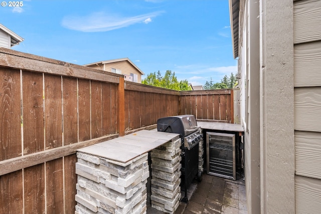 12795 Lindsay Anne Ln, Oregon City, OR 97045 - view of patio / terrace featuring exterior kitchen and wine cooler