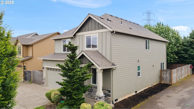 12795 Lindsay Anne Ln, Oregon City, OR 97045 - view of front of property with board and batten siding, driveway, an attached garage, and roof with shingles
