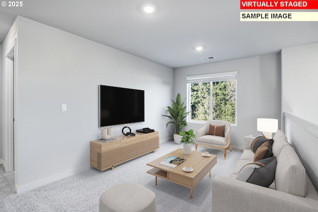 living area with visible vents, baseboards, recessed lighting, and carpet