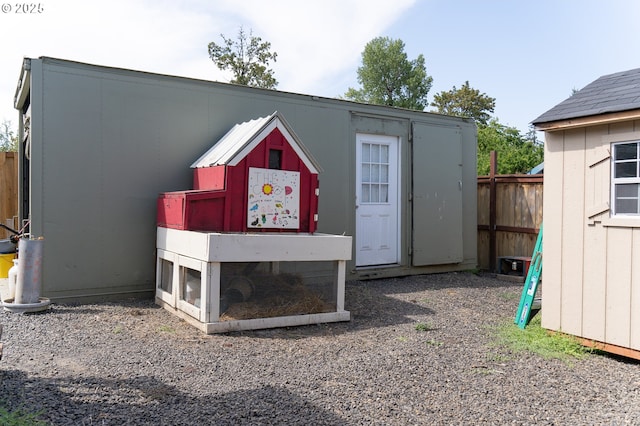 view of poultry coop featuring fence