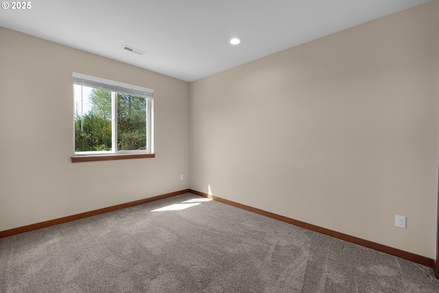 empty room with recessed lighting, baseboards, visible vents, and carpet