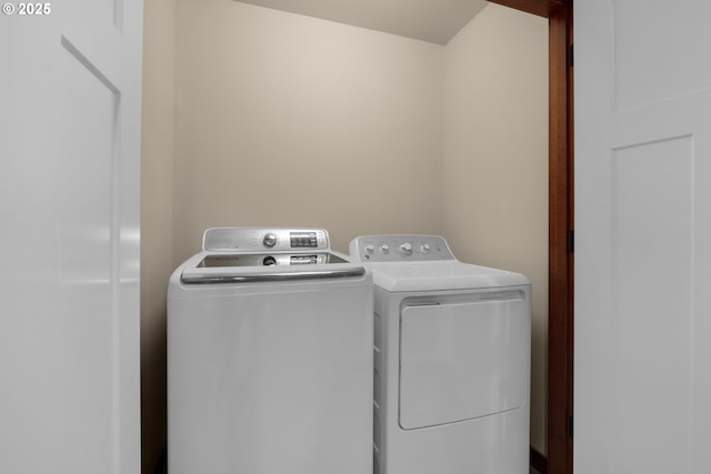clothes washing area featuring laundry area and independent washer and dryer
