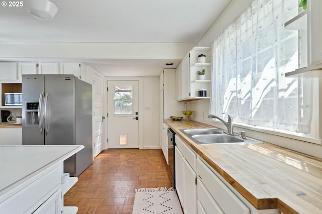 3620 NE 80th Ave, Portland, OR 97213 - kitchen featuring appliances with stainless steel finishes, light countertops, white cabinetry, a sink, and open shelves