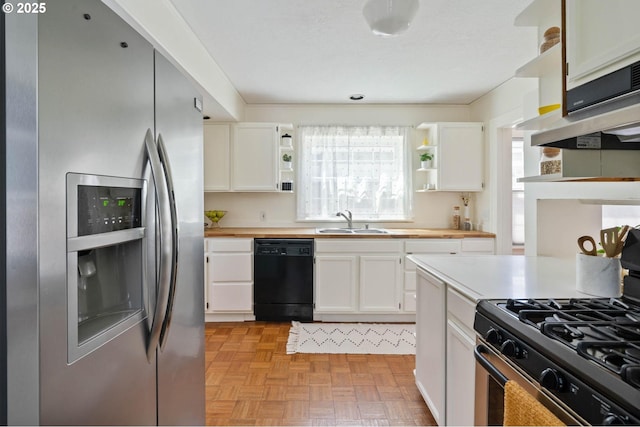 3620 NE 80th Ave, Portland, OR 97213 - kitchen with stainless steel fridge, black dishwasher, open shelves, range with gas cooktop, and a sink