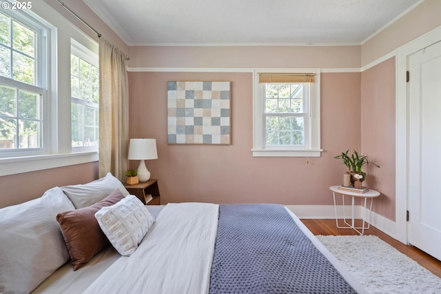 3620 NE 80th Ave, Portland, OR 97213 - bedroom featuring multiple windows, wood finished floors, baseboards, and ornamental molding
