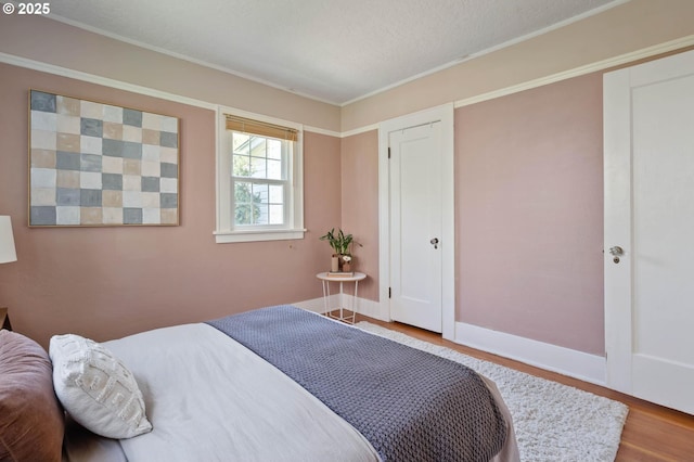 3620 NE 80th Ave, Portland, OR 97213 - bedroom with wood finished floors, baseboards, and crown molding