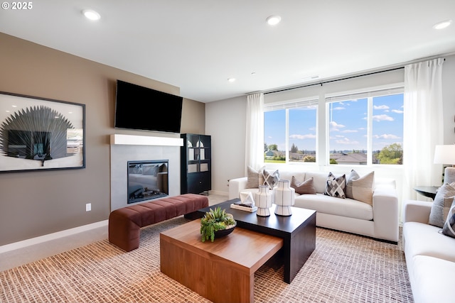 5591 N 87th Ave, Camas, WA 98607 - living room featuring light colored carpet, recessed lighting, and a glass covered fireplace