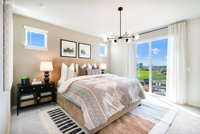 5591 N 87th Ave, Camas, WA 98607 - bedroom featuring carpet flooring, access to outside, and a chandelier