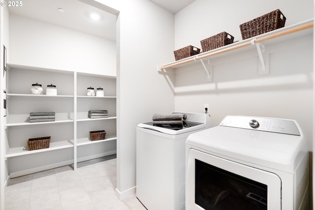 5591 N 87th Ave, Camas, WA 98607 - laundry area with washing machine and clothes dryer and light tile patterned flooring