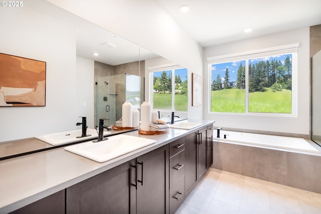 5591 N 87th Ave, Camas, WA 98607 - full bathroom with double vanity, a stall shower, tile patterned floors, a garden tub, and recessed lighting