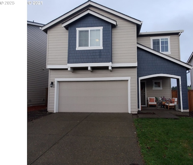 view of front facade with a garage and driveway