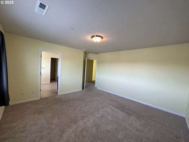 unfurnished bedroom with carpet flooring and baseboards